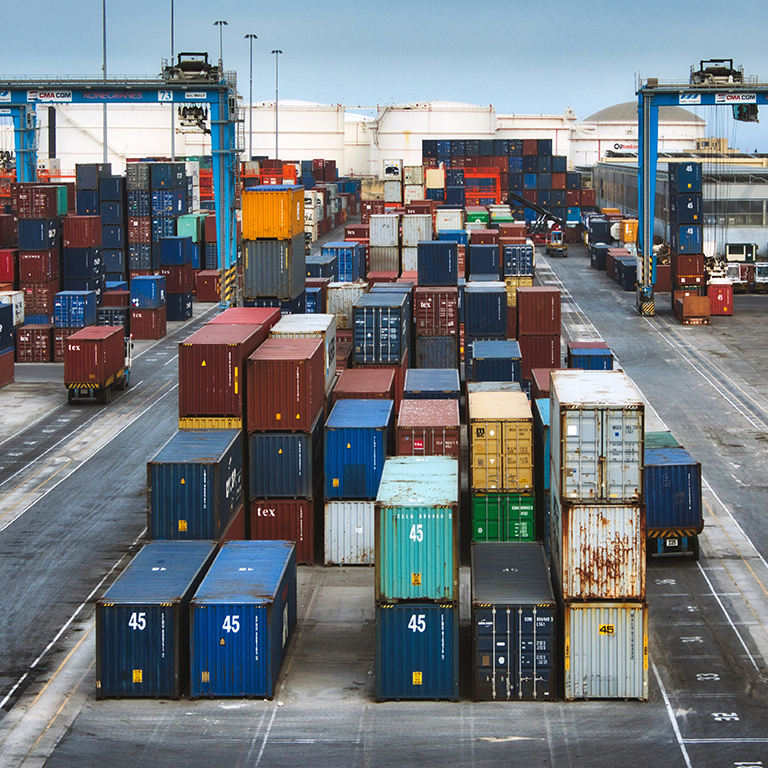 Cargo freight containers at a transhipment hub trade port