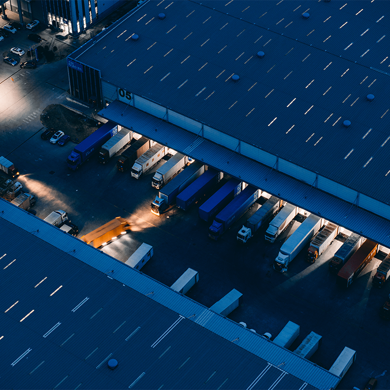 Container delivery truck at parking lot