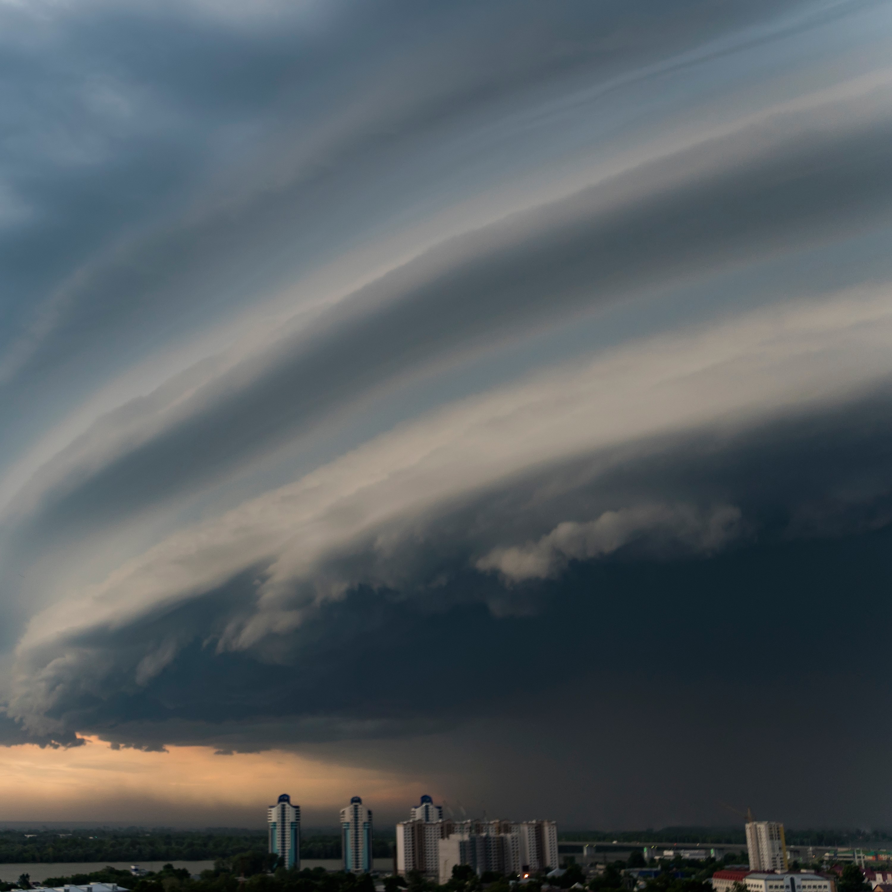 Storm cloud is approaching the city. Bad weather.